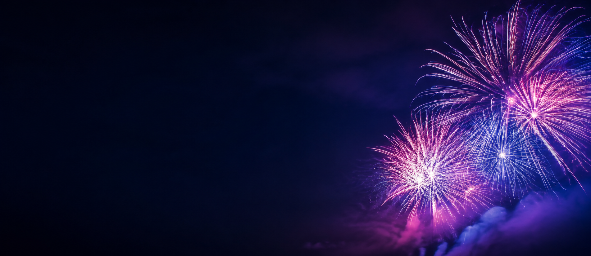 Violet and blue fireworks illuminating the night sky